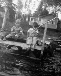 Myself on the left and my friend George on the right taken in 1950 at a place called Oliver Lake near Thunder Bay, Ontario, formerly Fort William.  My parents rented this old cottage for about 5 years in a row way back then, and this old photo drums up a plethora of memories. View full size.